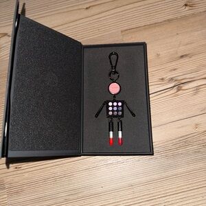 Black and Pink Keychain with Red Accents